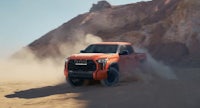 the 2020 chevrolet silverado is driving through the desert