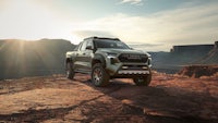 the 2020 toyota pickup truck is parked on a rocky cliff